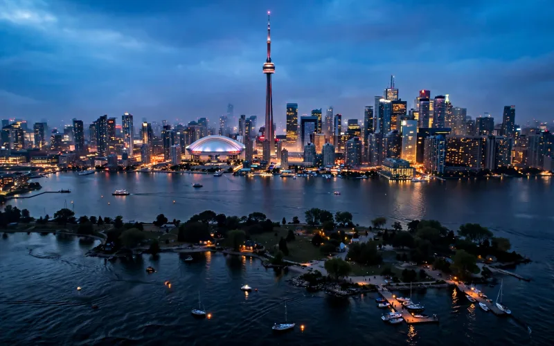 Toronto skyline with CN Tower and harbour islands at dusk