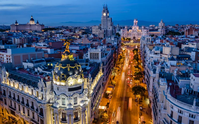Madrid skyline over Gran Vía and the Metropolis Building at blue hour