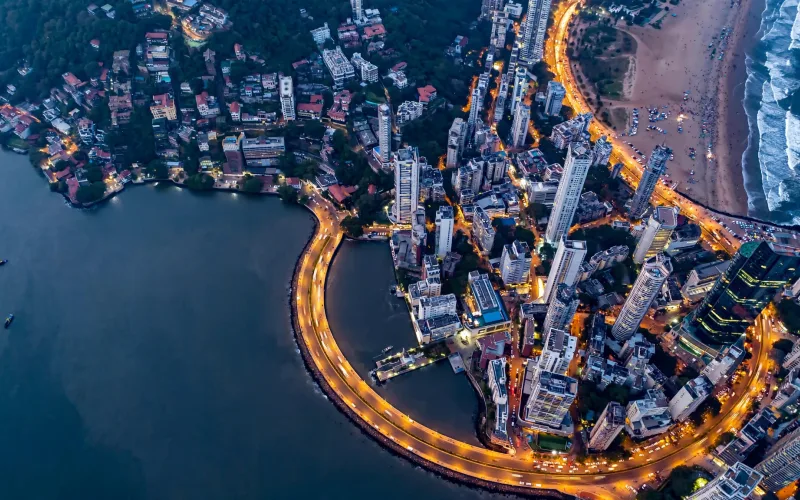 Mumbai skyline over Marine Drive and high-rises along the coast at blue hour