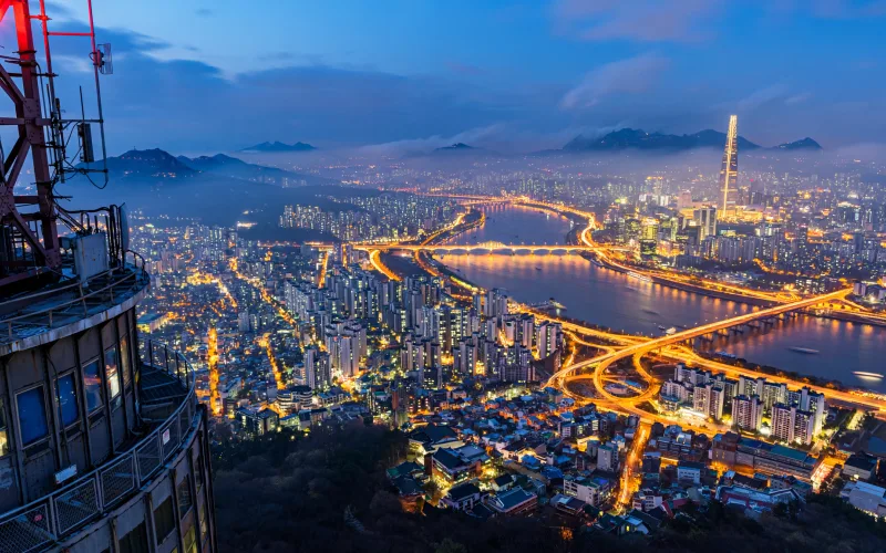 Seoul skyline over the Han River and Lotte World Tower at dusk
