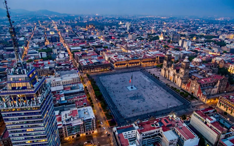 Mexico City Zócalo with cathedral and National Palace at blue hour