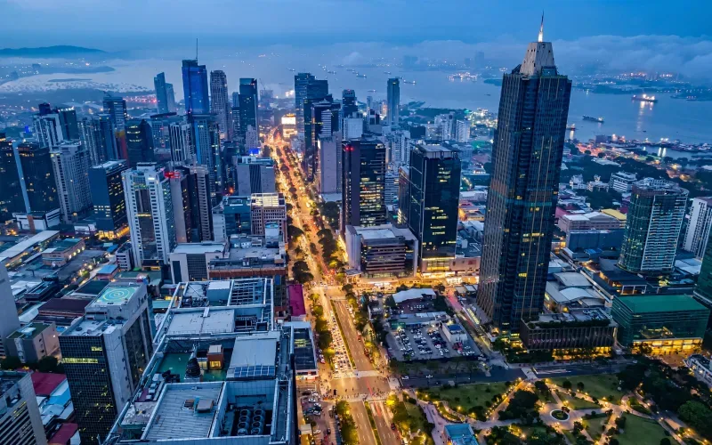 Manila skyline over Makati and high-rises at blue hour